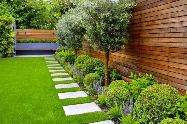 Modern garden landscape at Godrej Ivara Kharadi, Pune, showcasing lush greenery and stylish outdoor.