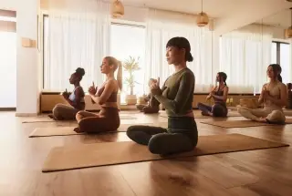 Gera Avive Towers Kharadi yoga class with residents practicing meditation and relaxation.