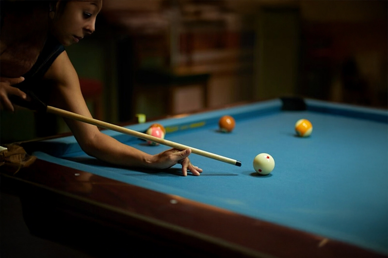 Pool table with balls and cue stick, ideal for recreation at Kohinoor Kaleido.
